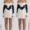 Alana svart og kremfarget off-shoulder-kjole