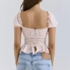 Cara rosa topp med blonder og peplum