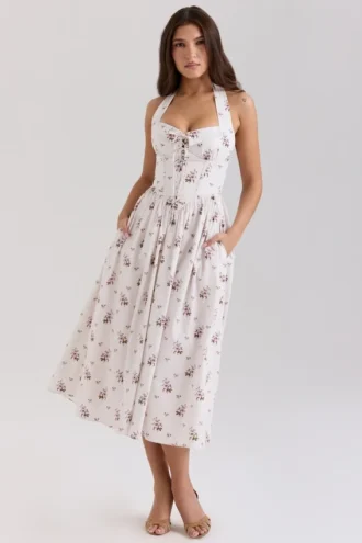 Emilia kremfarget midi-kjolelengde i stretchbomull med blomstertrykk og halterneck