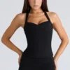 Peekaboo svart halterneck-korsetter