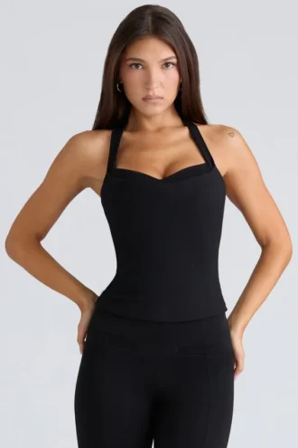 Peekaboo svart halterneck-korsetter