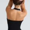 Peekaboo svart halterneck-korsetter