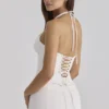 Zizi hvit halterneck-korsetter-topper med broderie anglaise