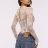 Zoe Vintage elfenbensfarget langermet korsetter-top i blonder